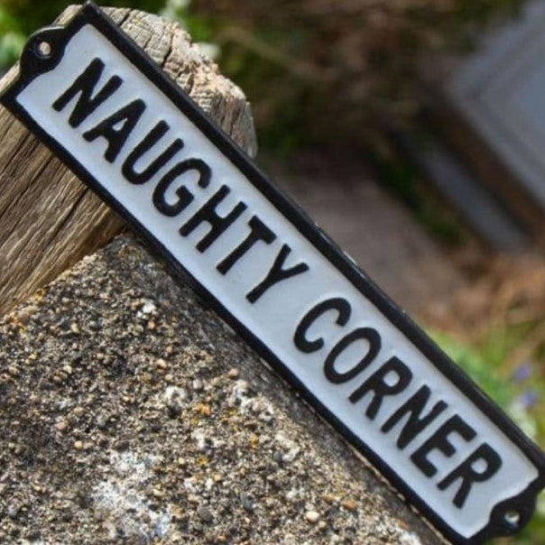 Naughty Corner metal sign
